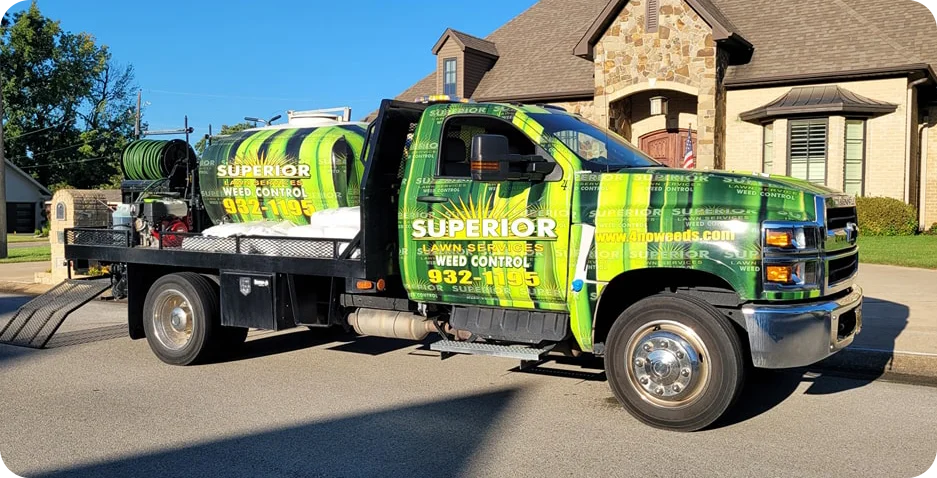 Superior Lawn Services Truck in front of house