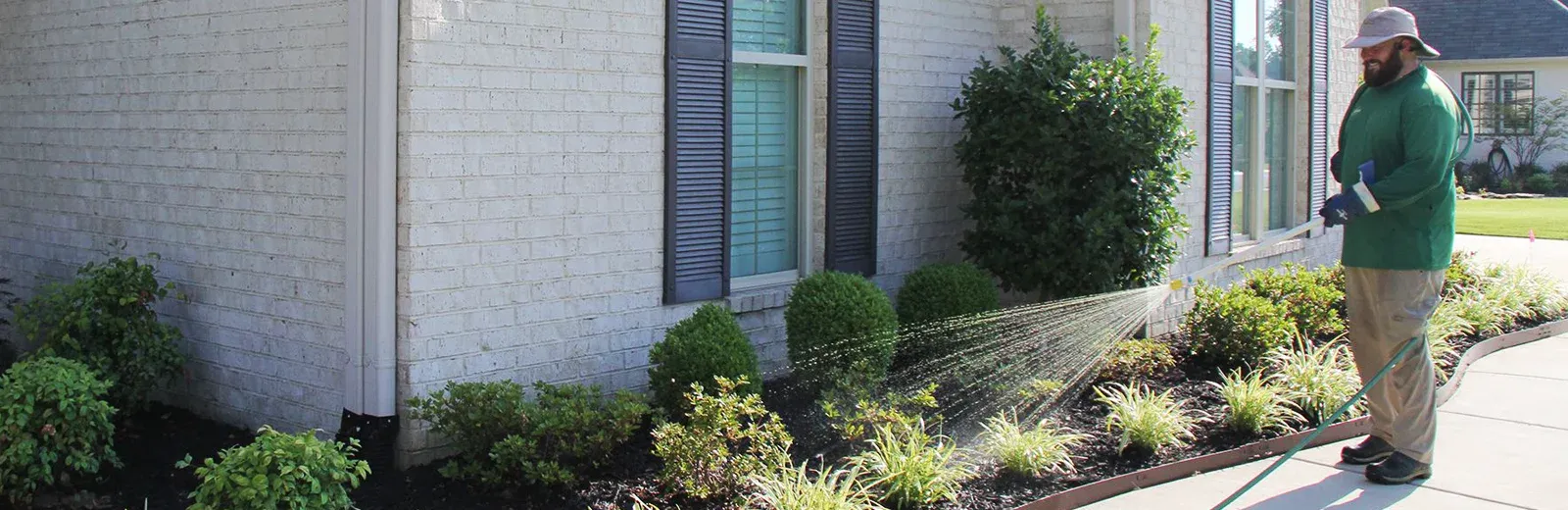 spraying perimeter of house